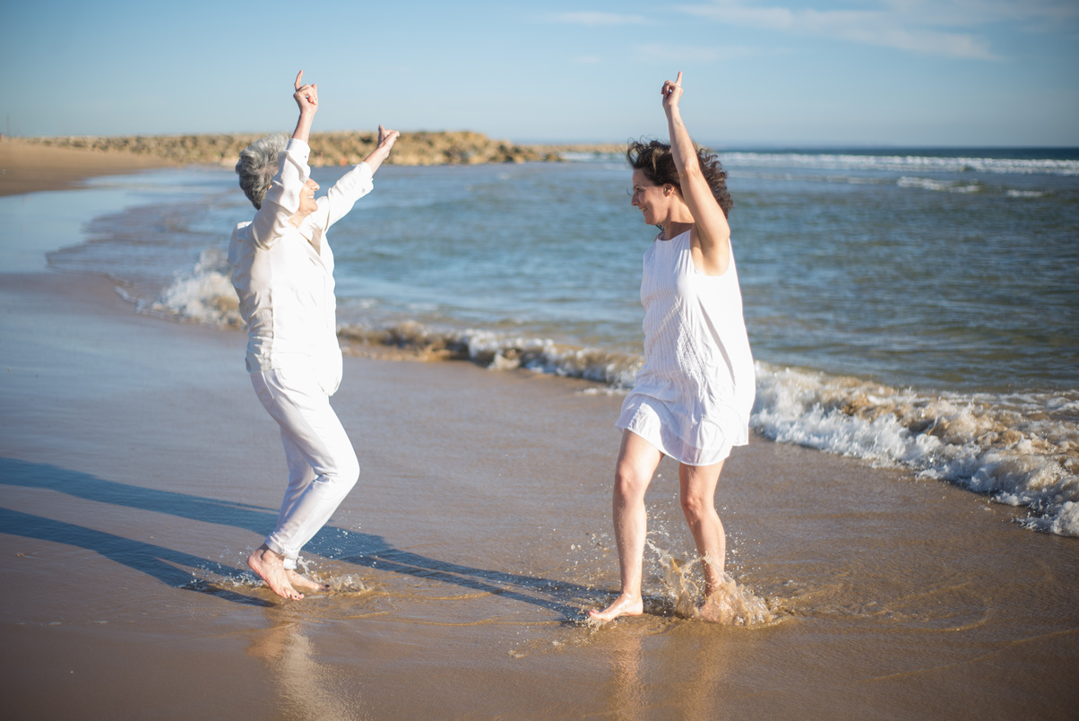 Women Dancing at the Beach